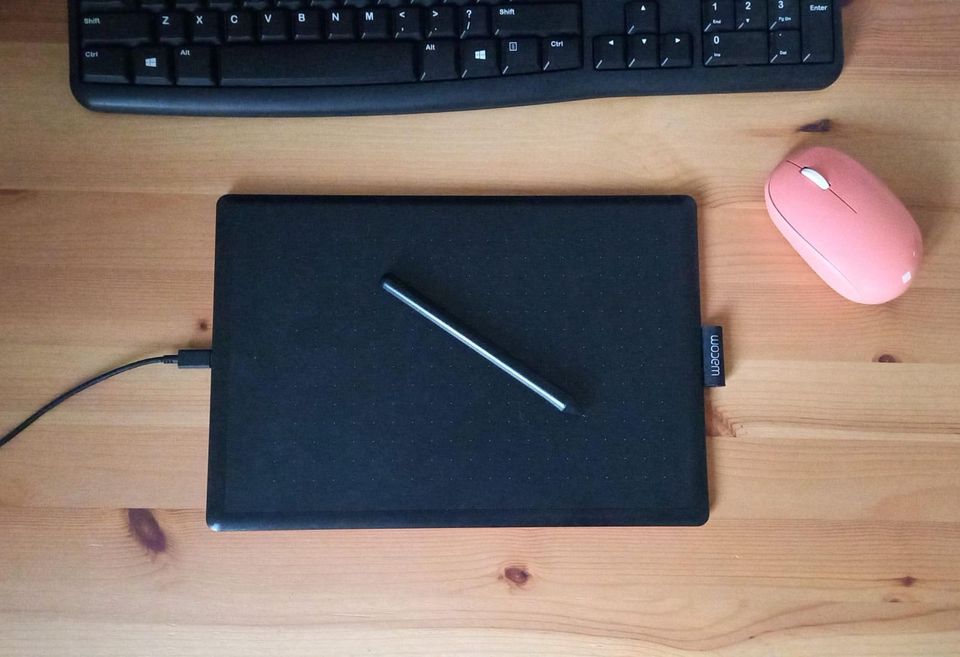 Minimal desk with a graphics tablet, keyboard and mouse